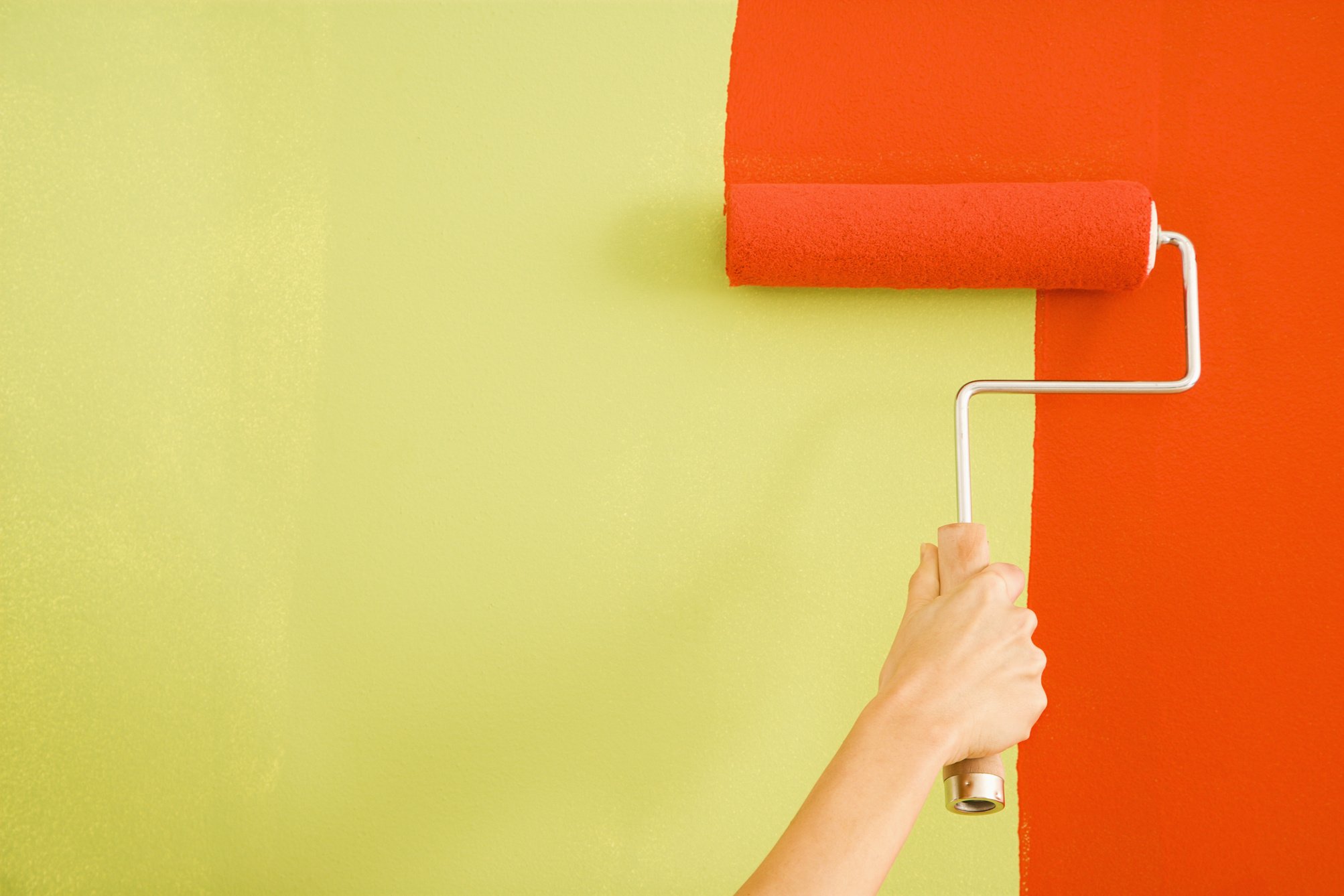 Woman Painting Wall.